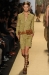A model walks the runway at the Michael Kors Spring 2012 fashion show during Mercedes-Benz Fashion Week at The Theater at Lincoln Center on September 14, 2011 in New York City.