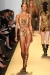 A model walks the runway at the Michael Kors Spring 2012 fashion show during Mercedes-Benz Fashion Week at The Theater at Lincoln Center on September 14, 2011 in New York City.