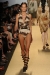 A model walks the runway at the Michael Kors Spring 2012 fashion show during Mercedes-Benz Fashion Week at The Theater at Lincoln Center on September 14, 2011 in New York City.